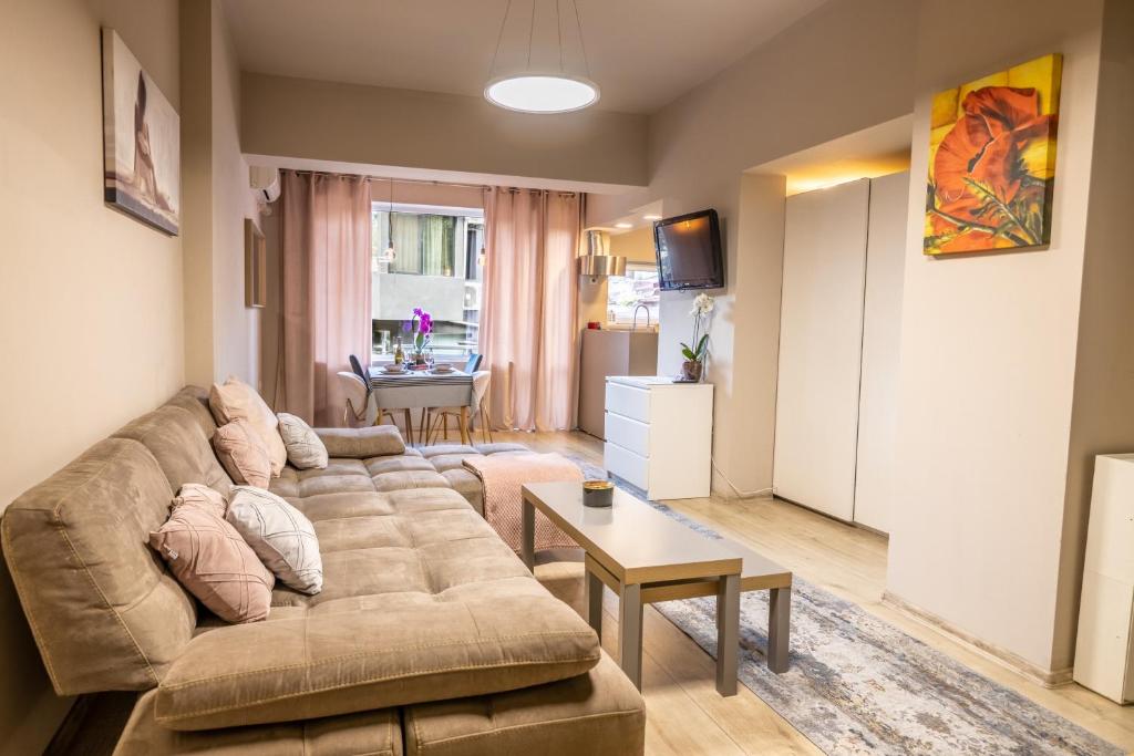 a living room with a couch and a table at City Center apartament “MARTA” in Varna City