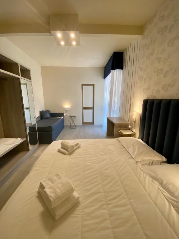 Postel nebo postele na pokoji v ubytování Hotel Liu