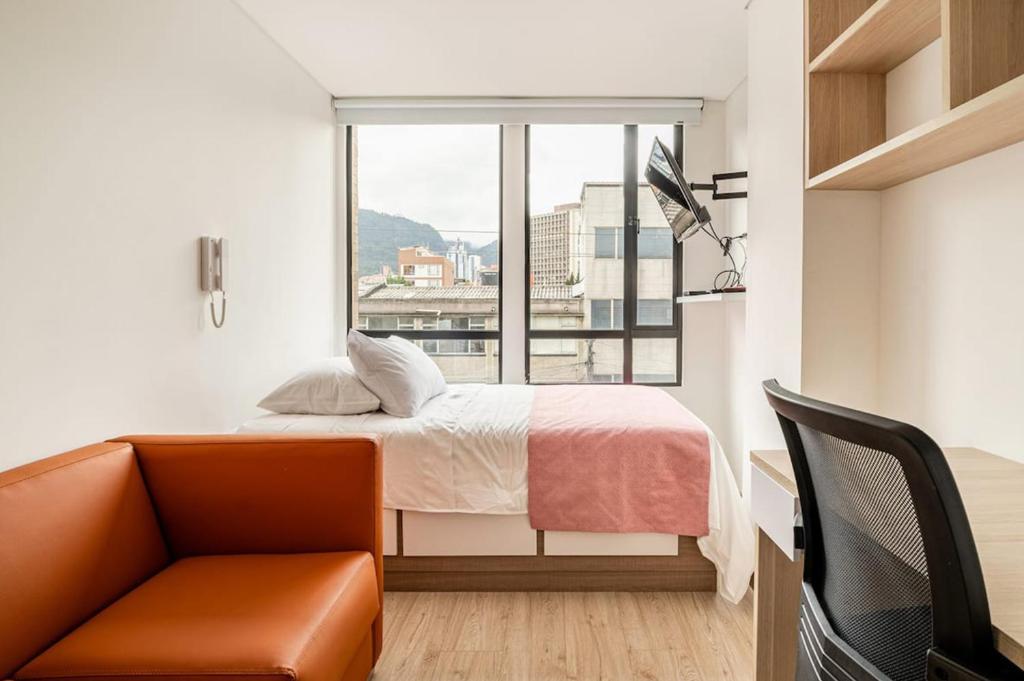 Postel nebo postele na pokoji v ubytování Apartahotel Connect Bogotá