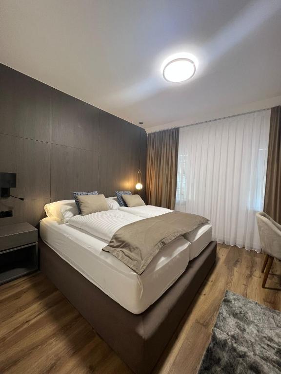 Postel nebo postele na pokoji v ubytování Hotel Harmshof Bispingen
