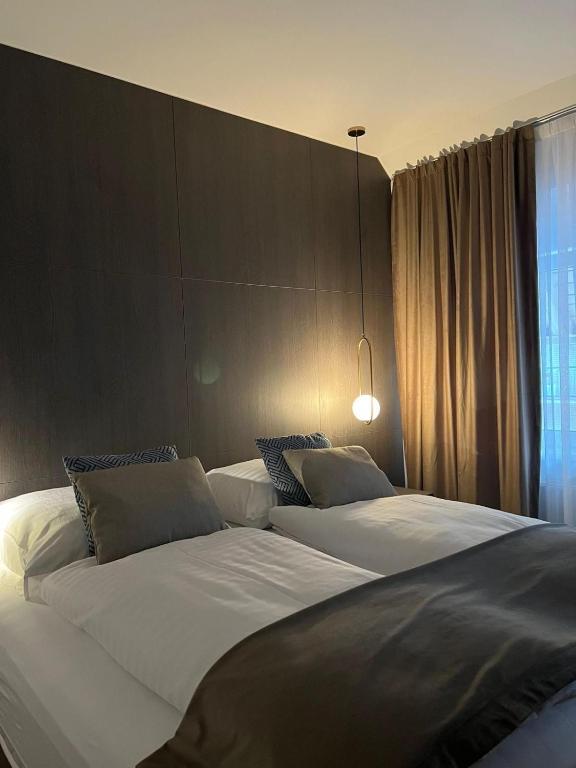 Postel nebo postele na pokoji v ubytování Hotel Harmshof Bispingen