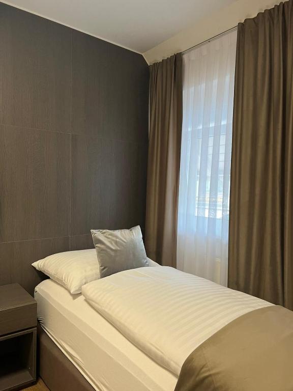 Postel nebo postele na pokoji v ubytování Hotel Harmshof Bispingen