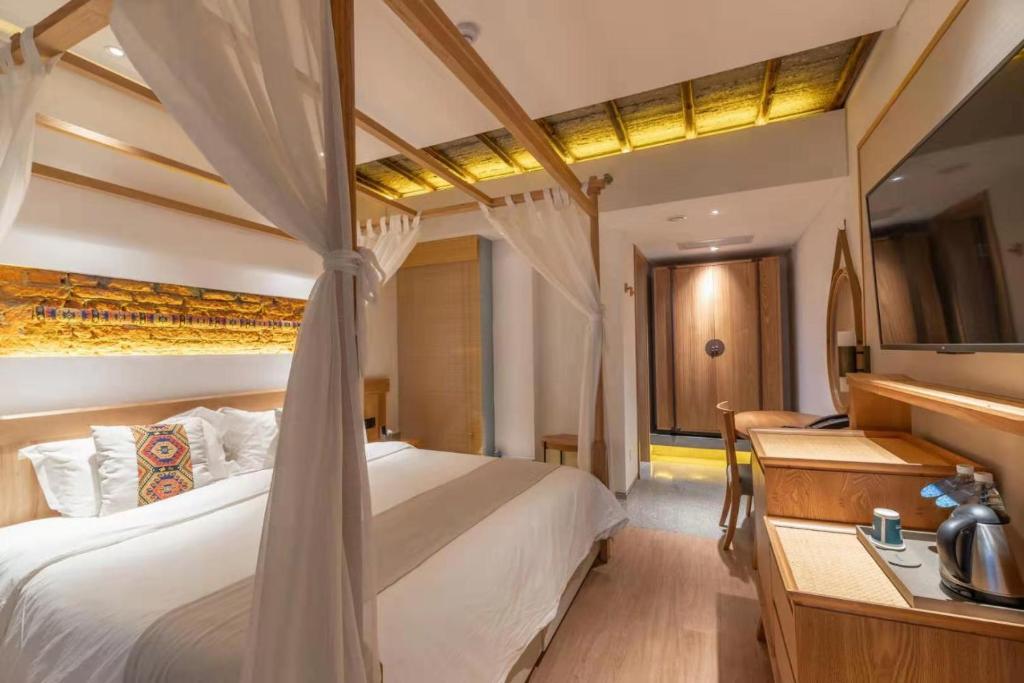 Postel nebo postele na pokoji v ubytování Yoba Boutique Hotel