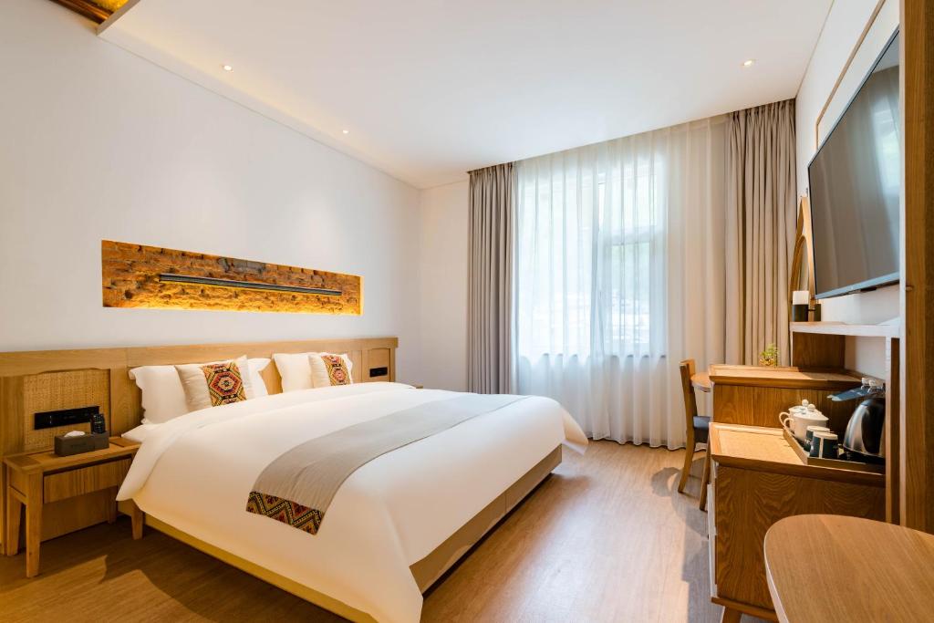 Postel nebo postele na pokoji v ubytování Yoba Boutique Hotel