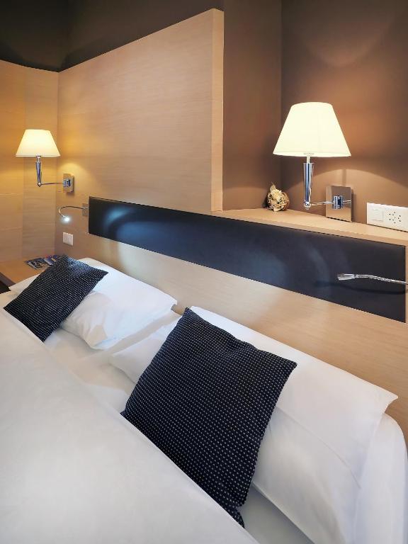 Postel nebo postele na pokoji v ubytování Ristorante Charme Hotel Tre Terre