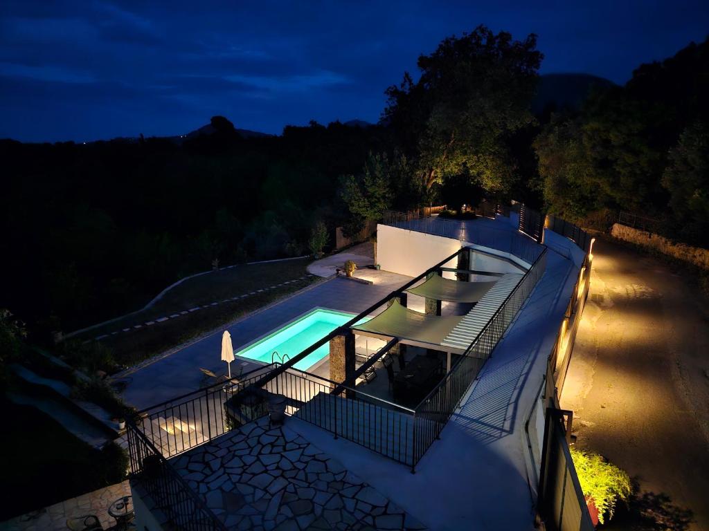 an overhead view of a house with a swimming pool at Ionian Juliet Villas in Kothoníkion