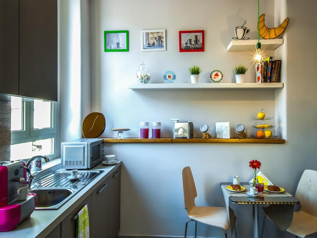 A kitchen or kitchenette at Your Bed Napoli