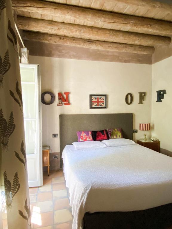 Postel nebo postele na pokoji v ubytování B&B Molino2Rosso