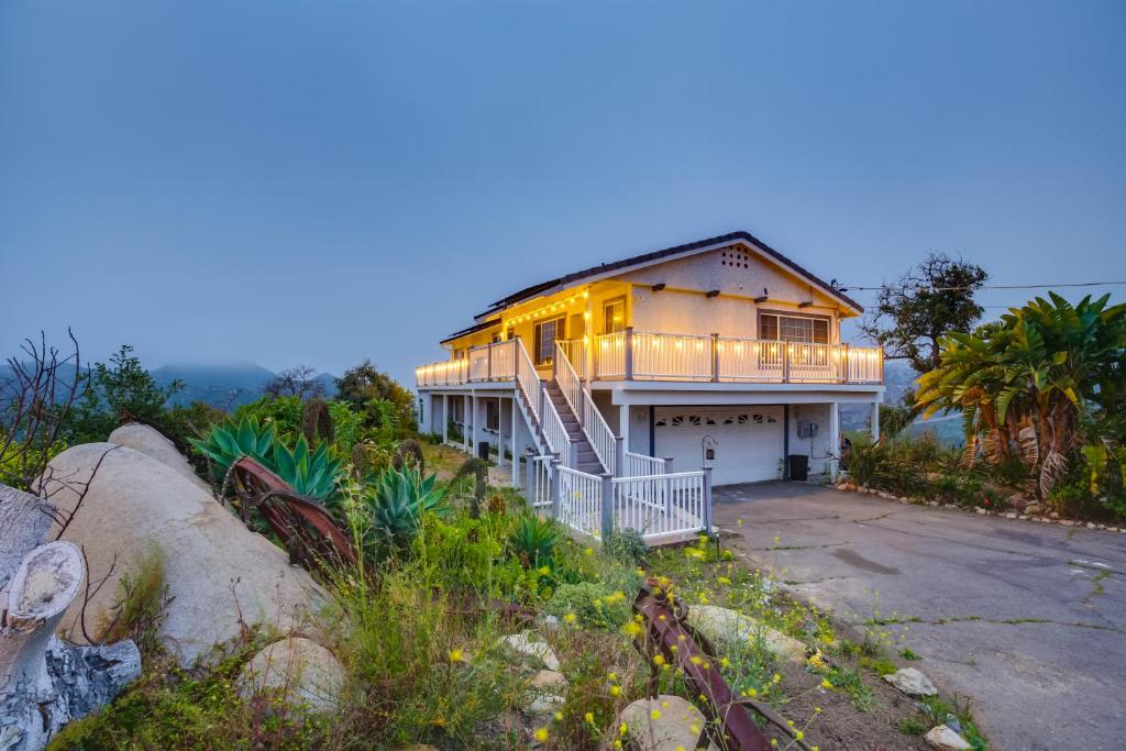 a house on a hill with its lights on at Escondido Hilltop Home with Deck and Views! in Escondido