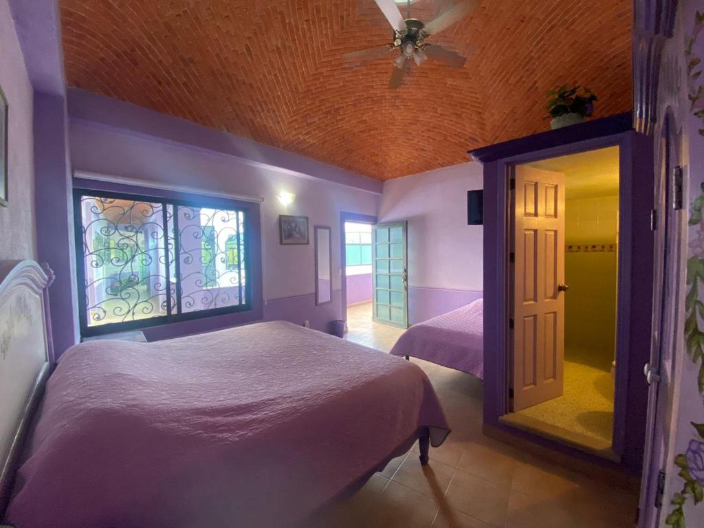 Un pat sau paturi într-o cameră la Casa Morada
