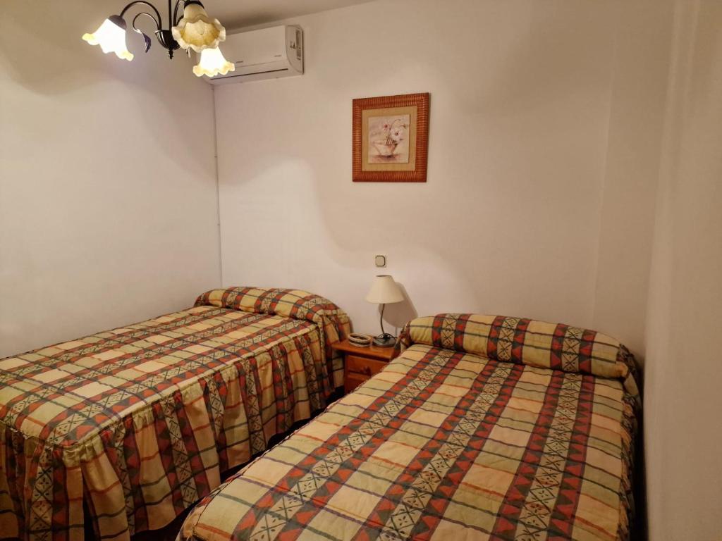 Postel nebo postele na pokoji v ubytování Casa Rural La Malena