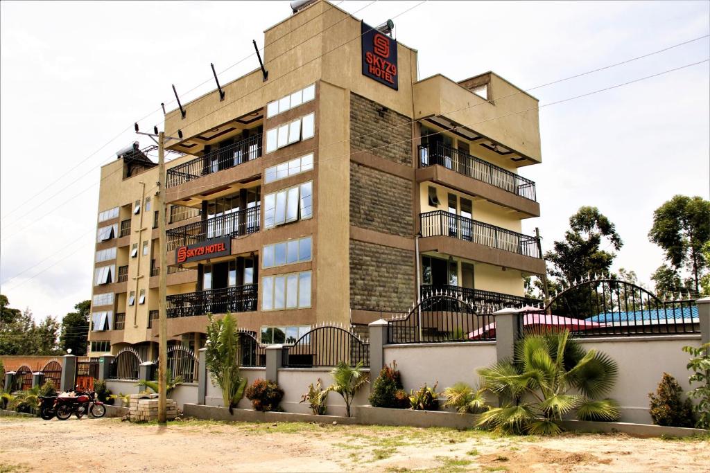 a tall building with a sign on top of it at SKYZ9 HOTEL in Kakamega
