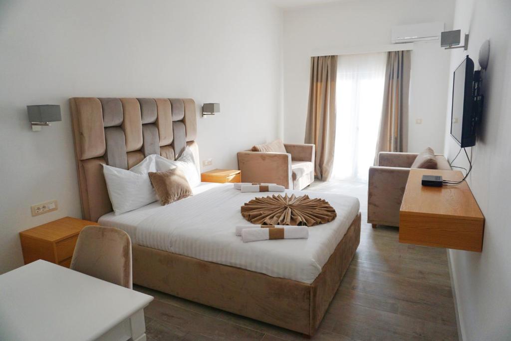 Postel nebo postele na pokoji v ubytování Hotel Credo