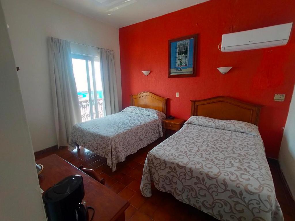 Postel nebo postele na pokoji v ubytování Hotel Posada Doña Lala
