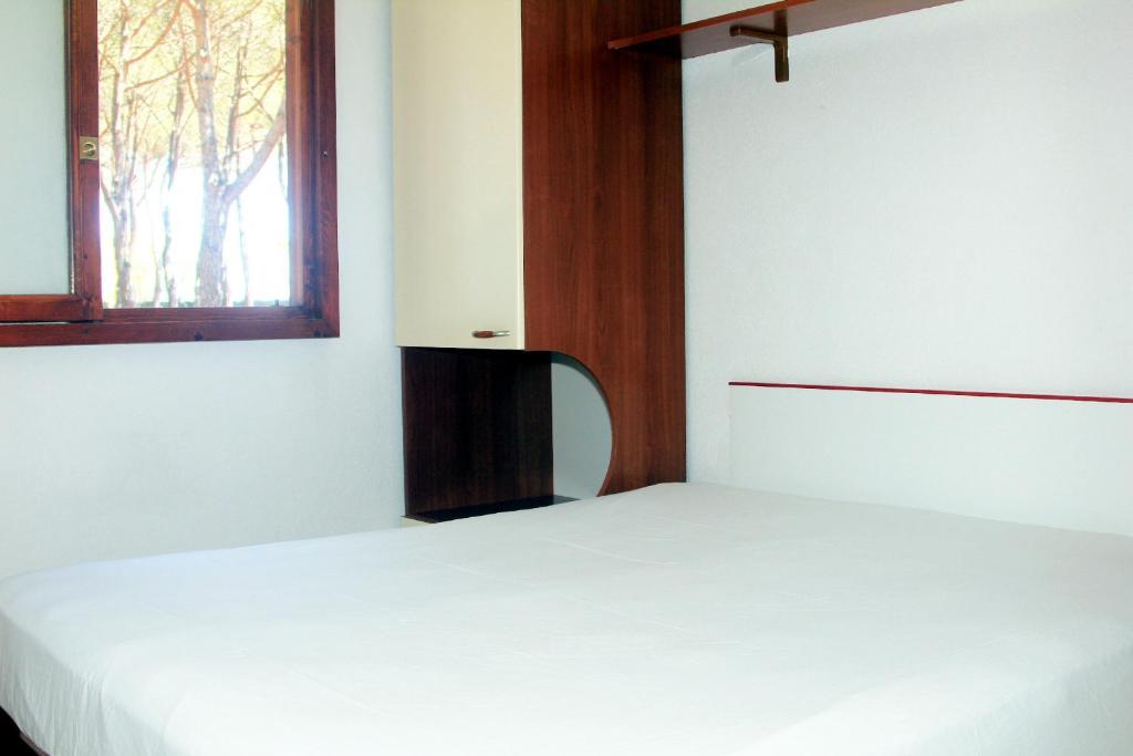 Postel nebo postele na pokoji v ubytování Camping Serenella