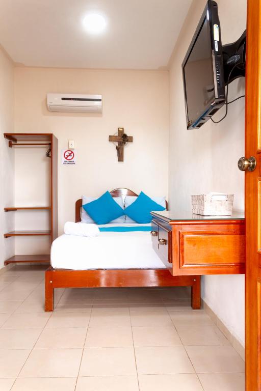 Postel nebo postele na pokoji v ubytování Hotel Bacalar Magico