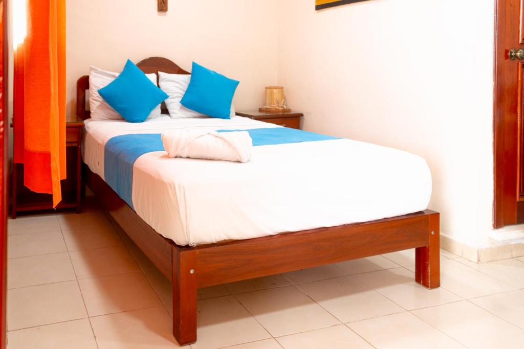Postel nebo postele na pokoji v ubytování Hotel Bacalar Magico