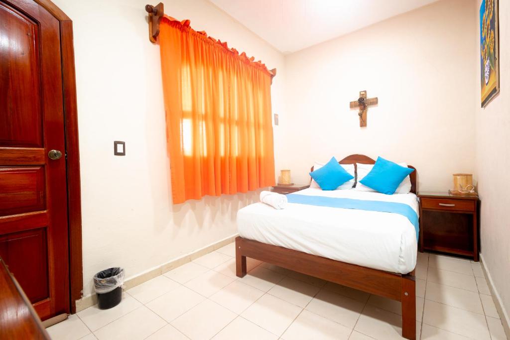 Postel nebo postele na pokoji v ubytování Hotel Bacalar Magico
