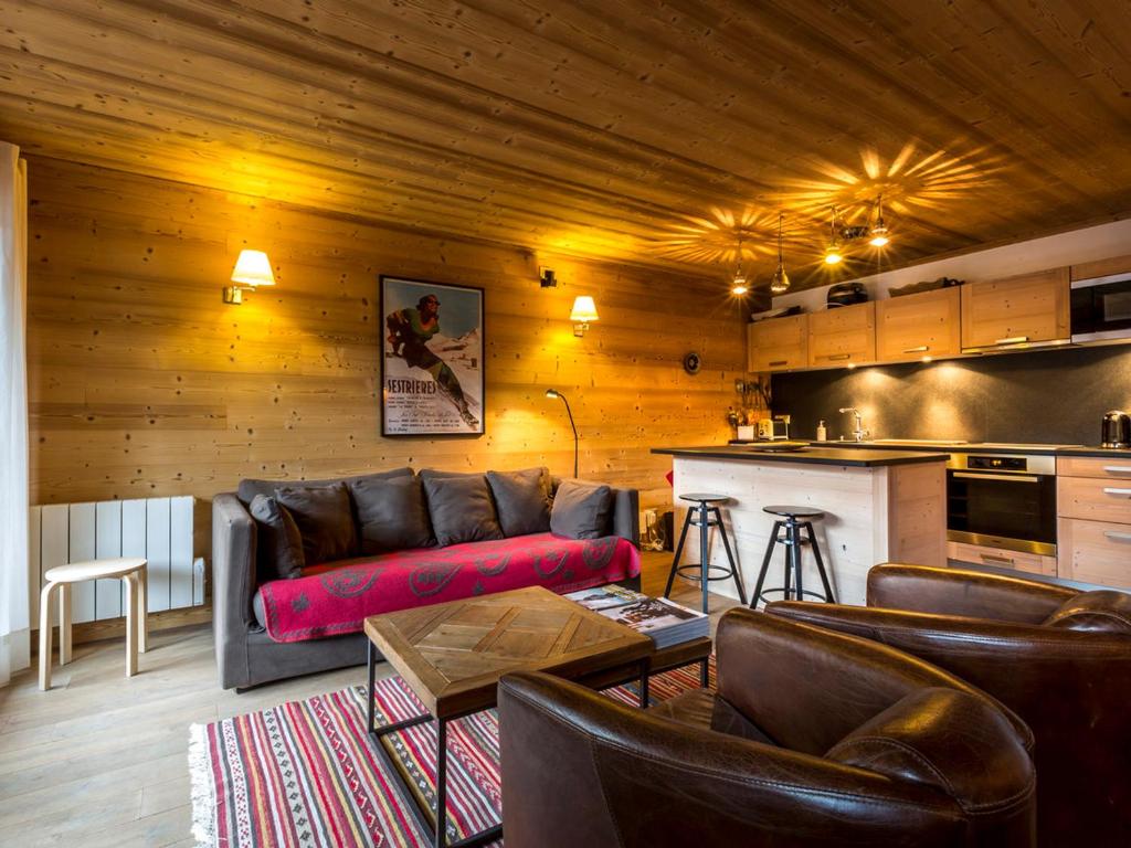 a living room with a couch and a kitchen at Appartement de standing, 3 chambres, balcon sud, centre de Val-d'Isère, proche pistes et commerces - FR-1-694-307 in Val dʼIsère