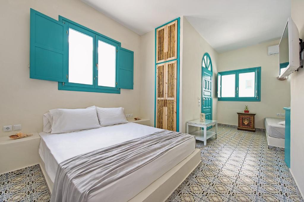 Postel nebo postele na pokoji v ubytování Nissia Beach Apartments & Suites