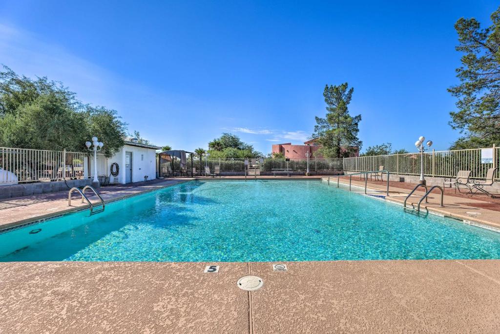a swimming pool with blue water in a yard at Eloy Vacation Rental with Pool Access and Courtyard! in Eloy