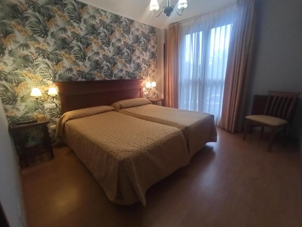 Cama o camas de una habitación en La Estrada