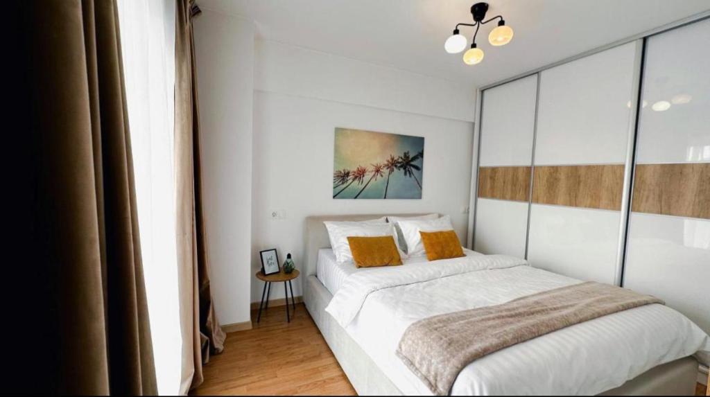 Ein Bett oder Betten in einem Zimmer der Unterkunft NOVA Apartment