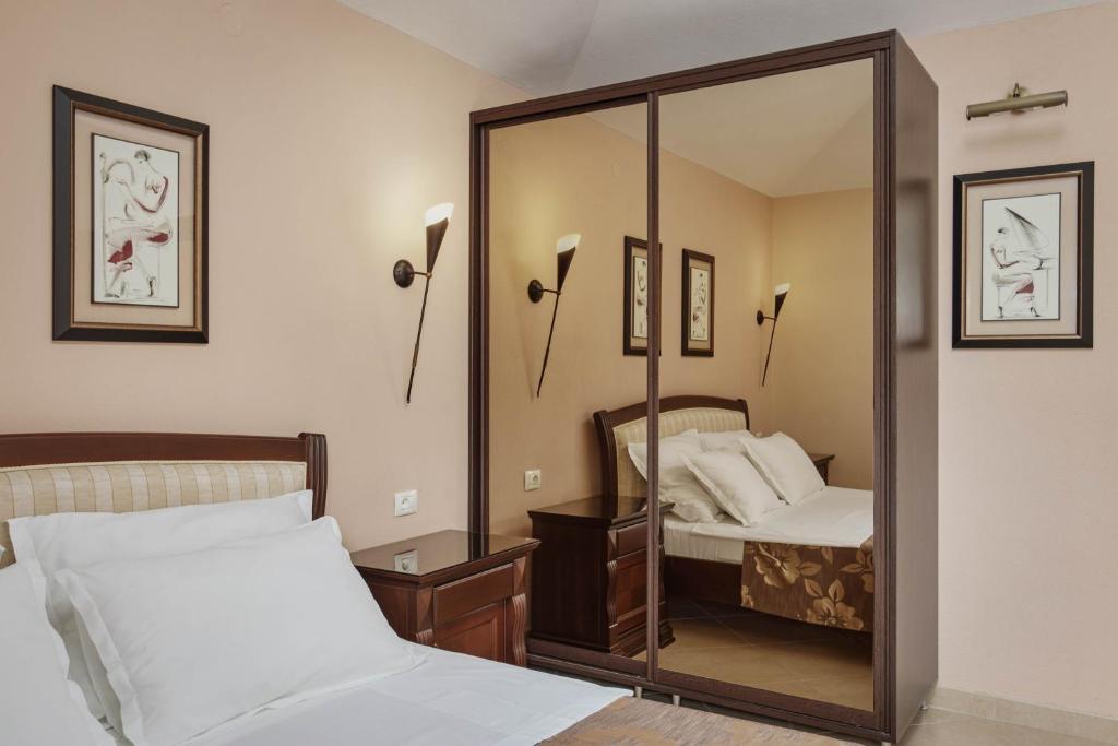 Postel nebo postele na pokoji v ubytování Apartments Djuranovic