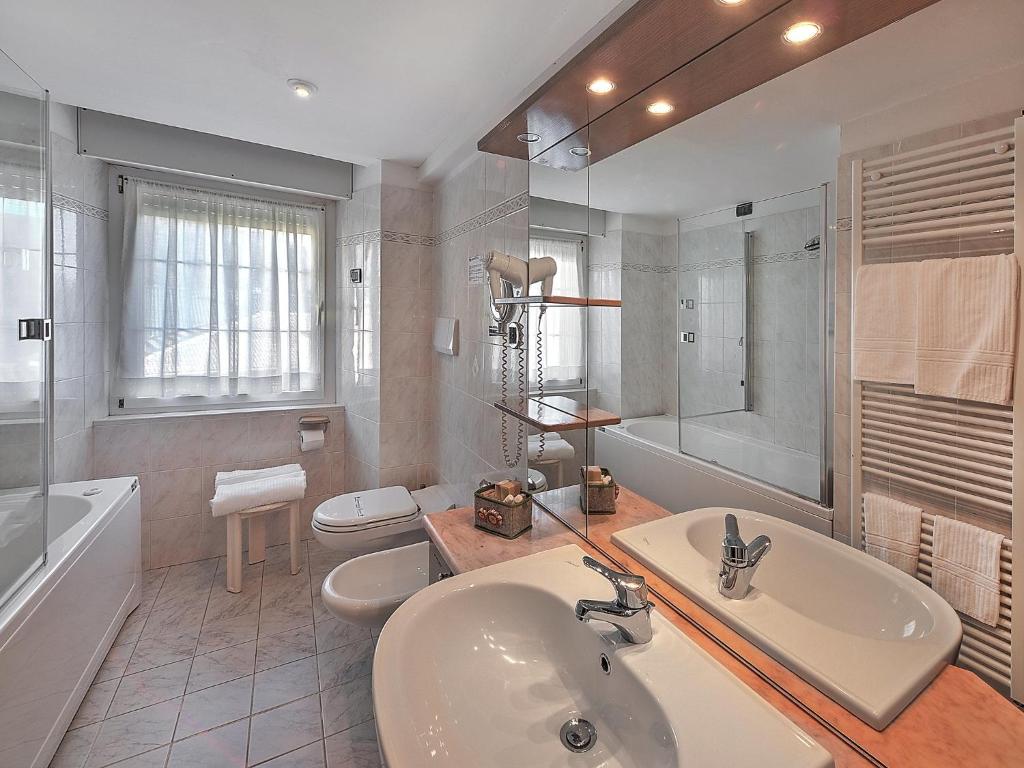 Ein Badezimmer in der Unterkunft Al Posta Hotel 1899