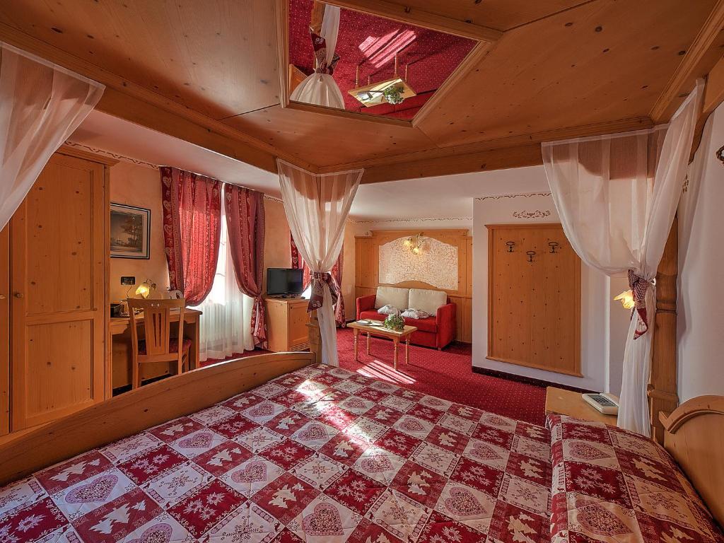 Ein Bett oder Betten in einem Zimmer der Unterkunft Al Posta Hotel 1899