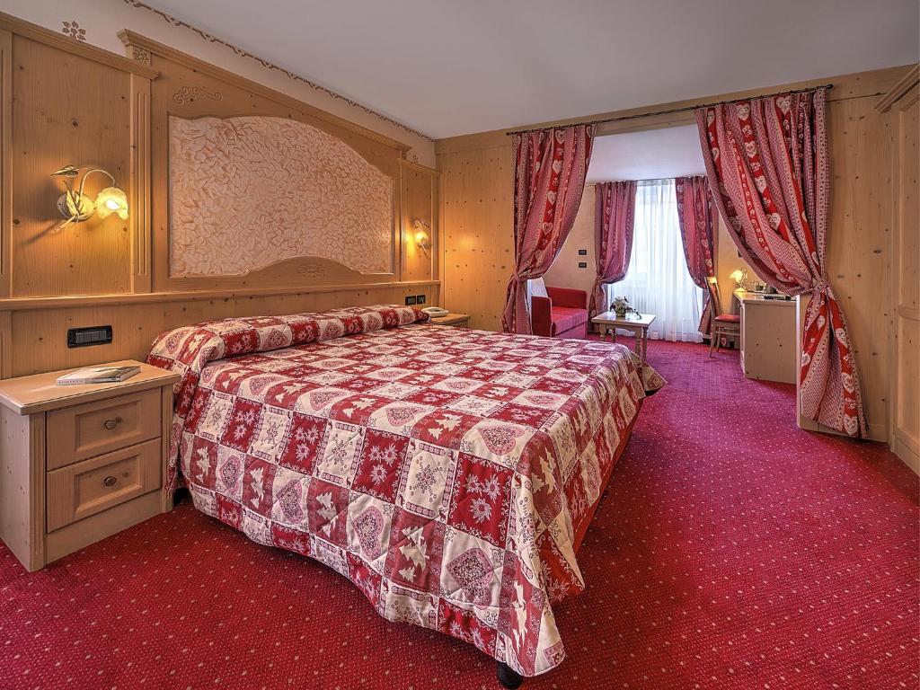 Ein Bett oder Betten in einem Zimmer der Unterkunft Al Posta Hotel 1899
