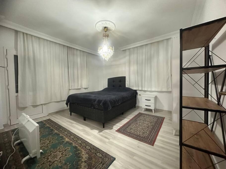 Postel nebo postele na pokoji v ubytování Başkaya Homes