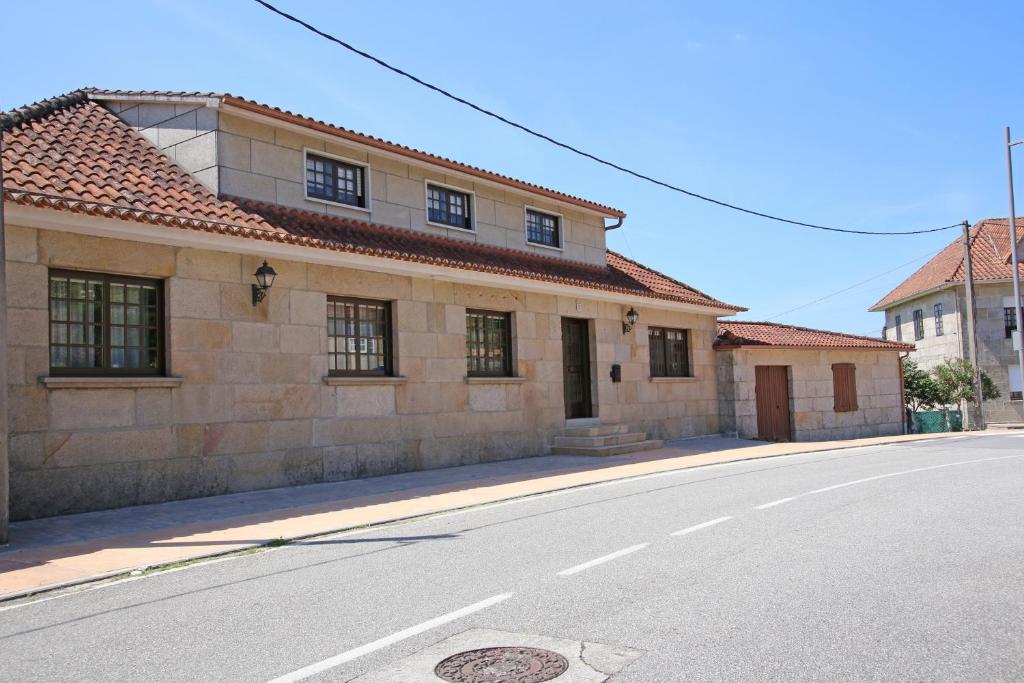 a building on the side of a street at Os de Rey in Pontevedra