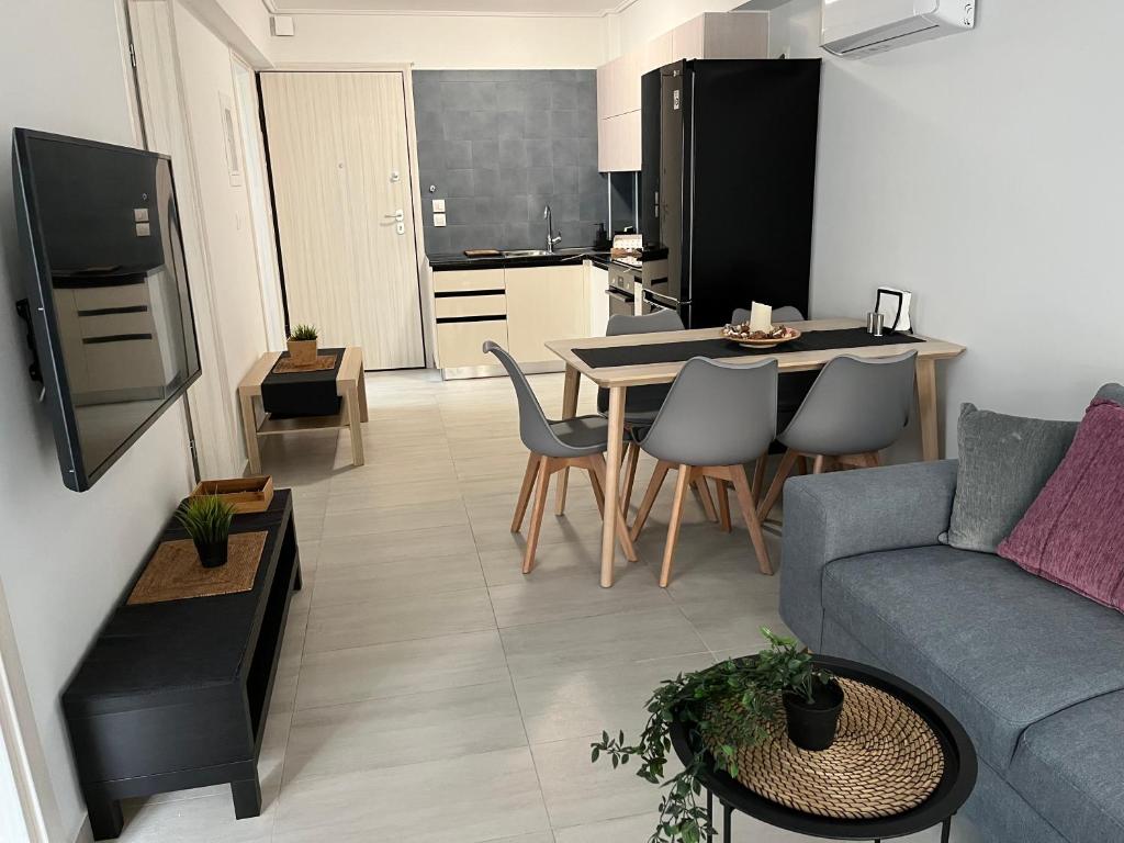 a living room with a couch and a table at Vamelon in Athens
