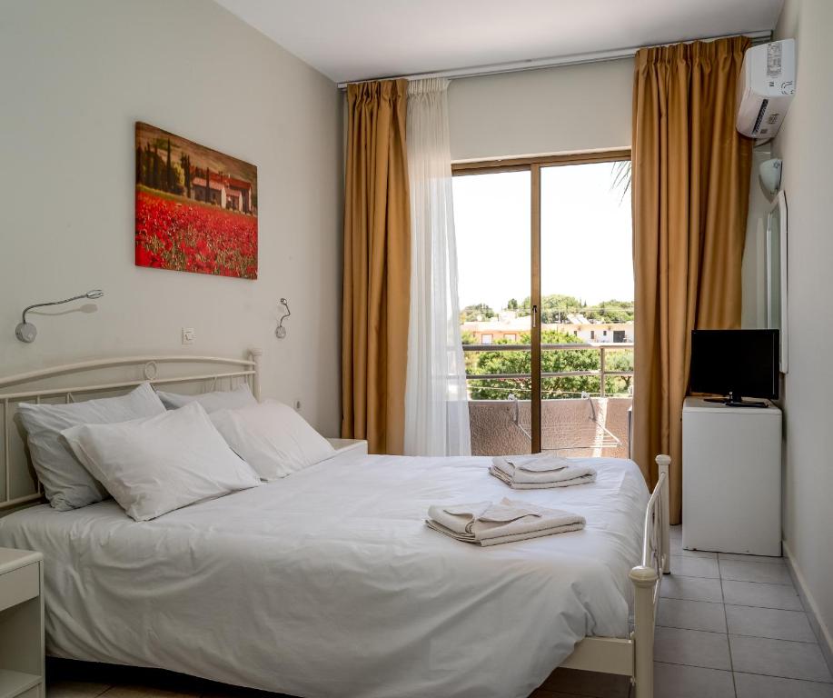 Voodi või voodid majutusasutuse IVORY HOTEL toas
