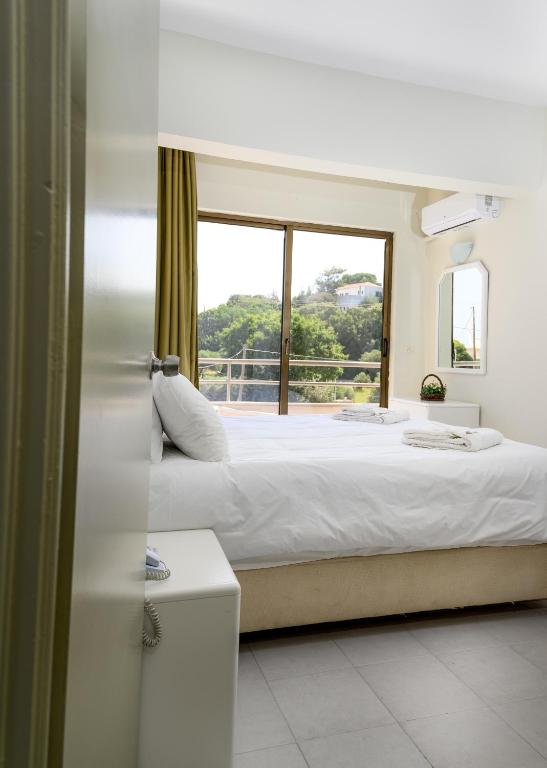 Voodi või voodid majutusasutuse IVORY HOTEL toas