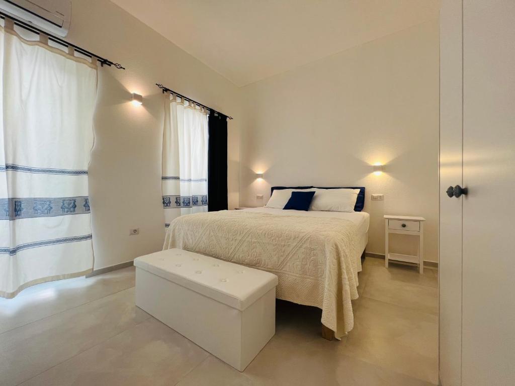 Postel nebo postele na pokoji v ubytování Via Giardini Rooms