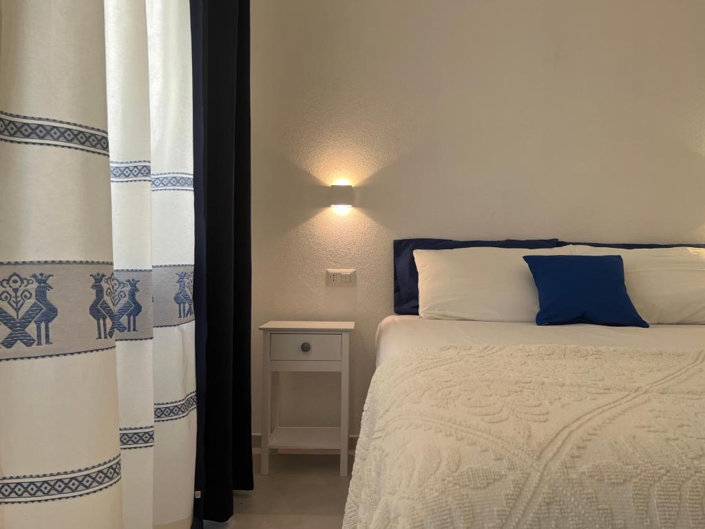 Postel nebo postele na pokoji v ubytování Via Giardini Rooms