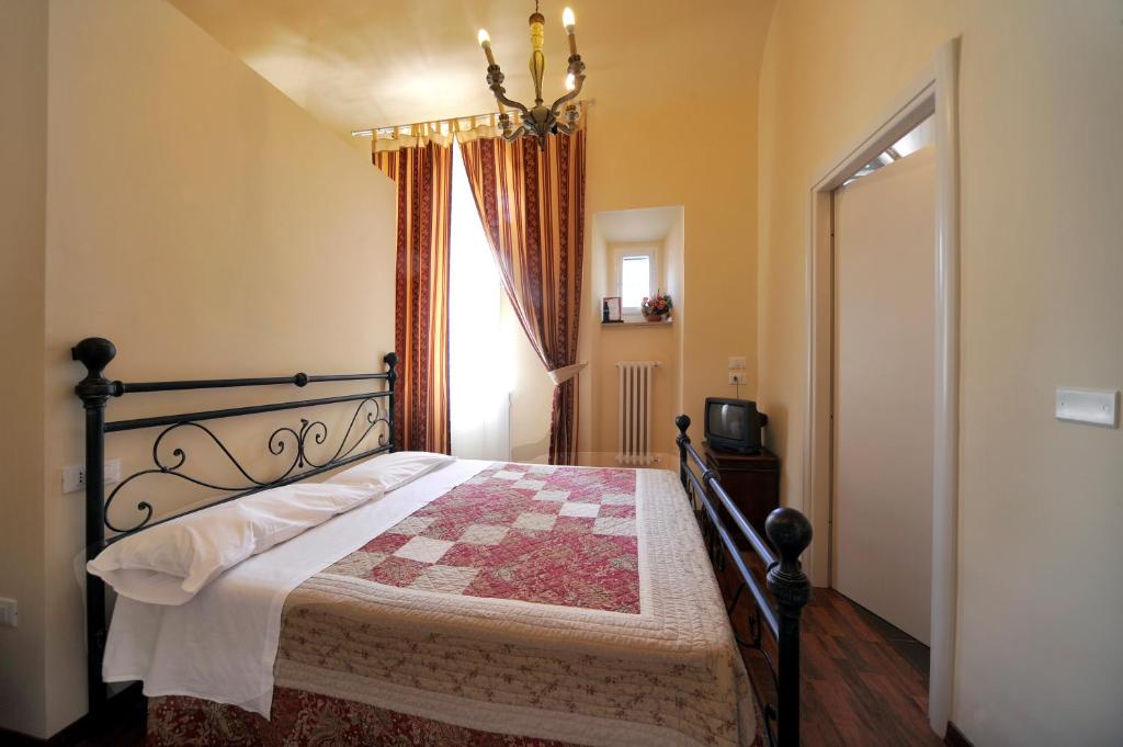 Postel nebo postele na pokoji v ubytování Hotel Iris