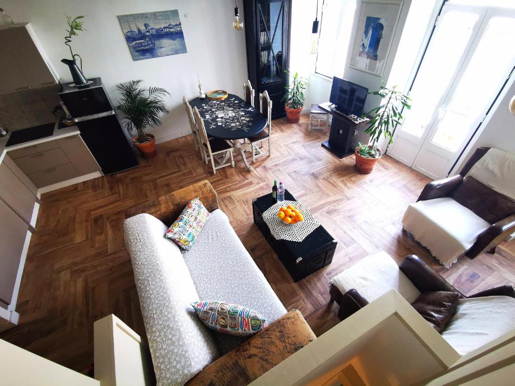an overhead view of a living room with furniture at Charming Portuguese style apartment, for rent "Vida à Portuguesa", "Gaivota" Alojamento Local in Portimão