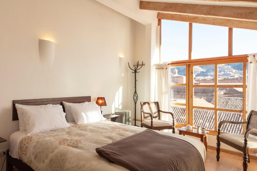 Postel nebo postele na pokoji v ubytování SAMANA B&B