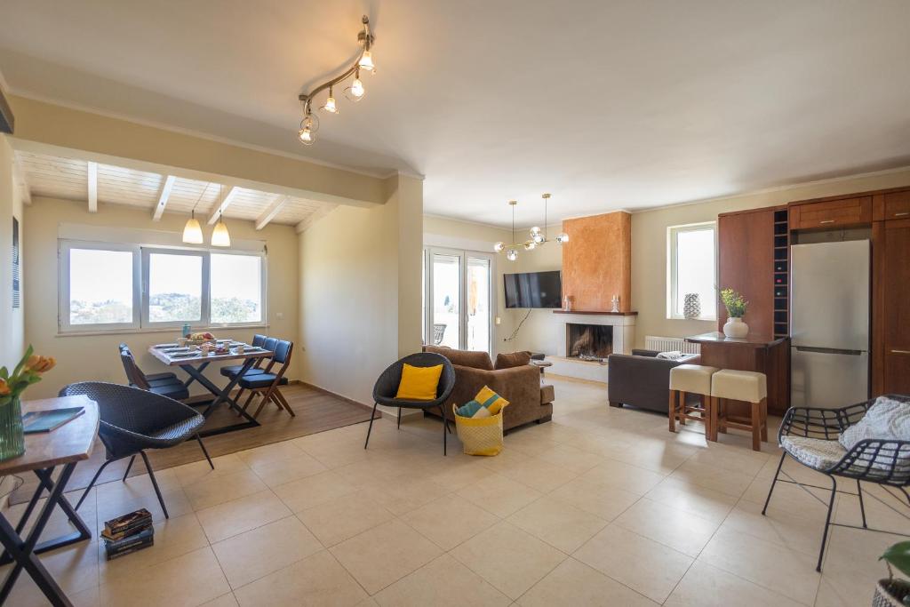 a living room with a couch and a table at ioli Corfu maisonette in Kastanéa