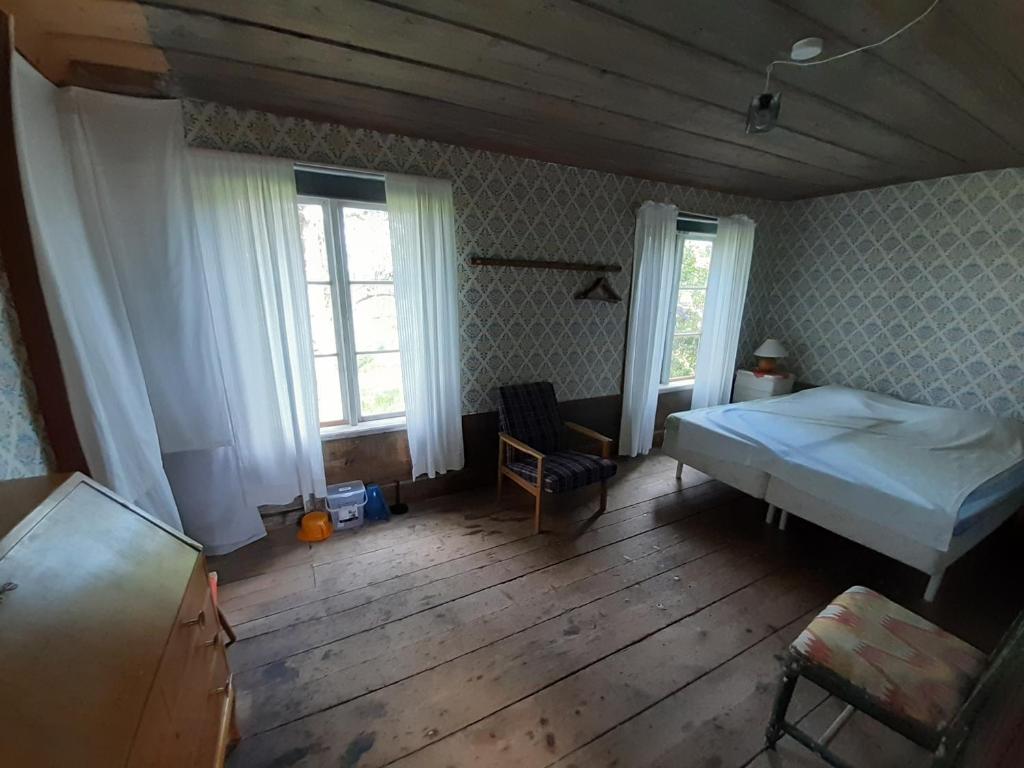 Postel nebo postele na pokoji v ubytování Frägsta Hälsingegård B&B