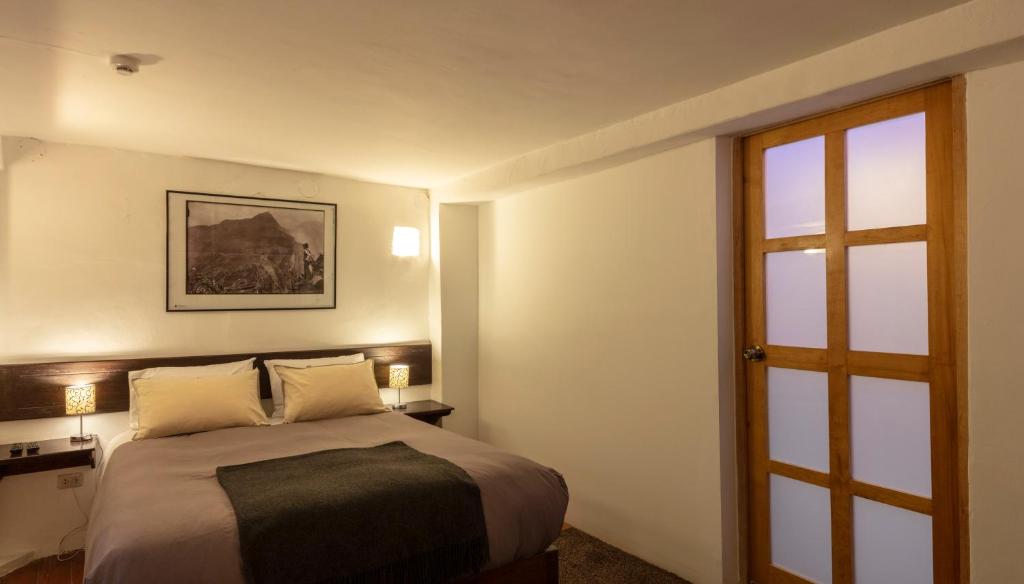 Postel nebo postele na pokoji v ubytování SAMANA B&B