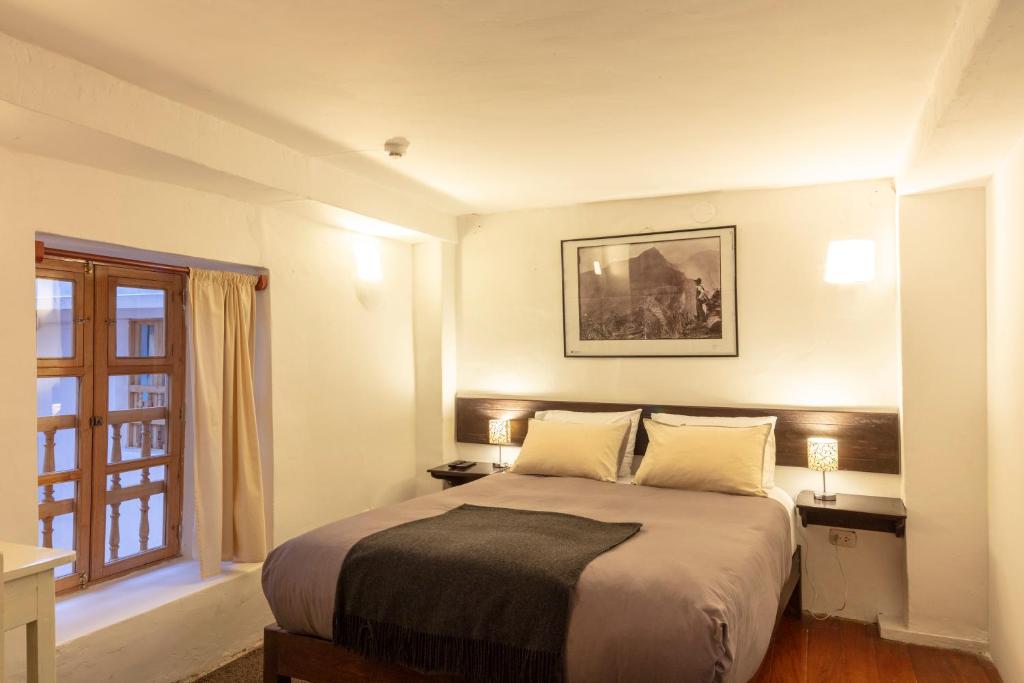 Postel nebo postele na pokoji v ubytování SAMANA B&B
