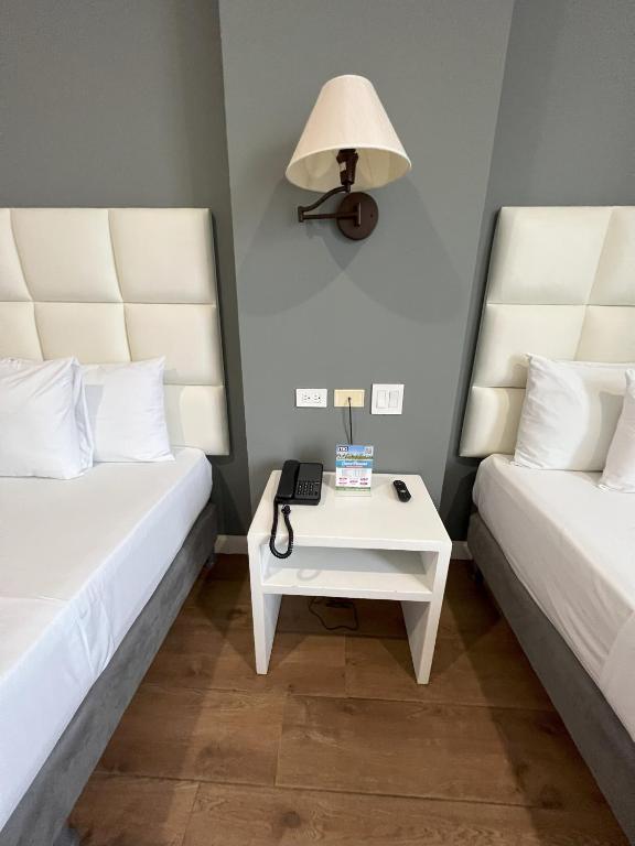Postel nebo postele na pokoji v ubytování Hotel Mio Panamá
