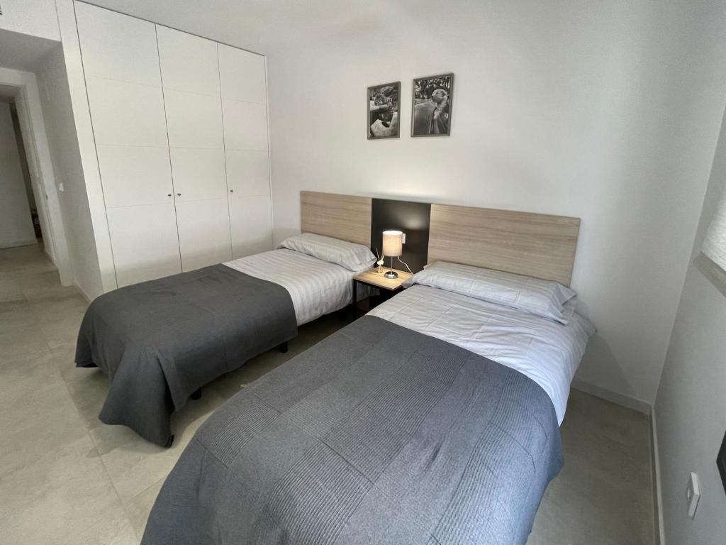 Postel nebo postele na pokoji v ubytování SEASCAPE LUXURY APARTMENT