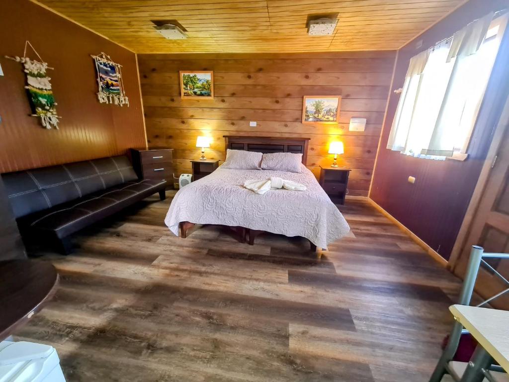 Cama o camas de una habitación en Cabañas Kompatzki