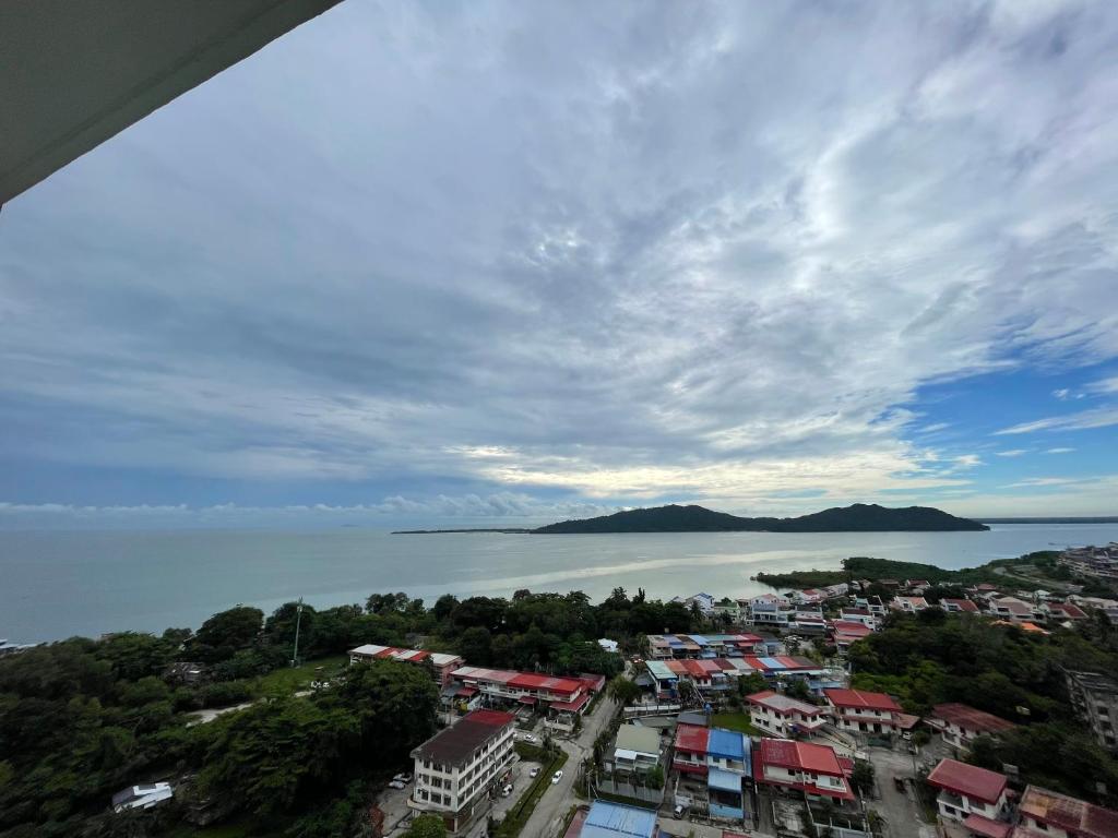 an aerial view of a city and the water at Inns Homestay in Sandakan