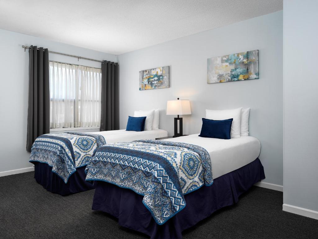Cama o camas de una habitación en Huntingdon Hotel and Suites
